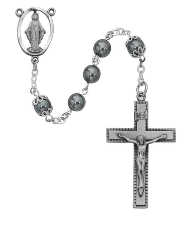 7mm imitation hematite rosary with pewter crucifix and center in dark gunmetal tone displayed on white background