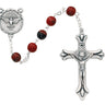 7mm Holy Spirit rosary with red and black plastic beads and silver oxidized crucifix and center piece on white background