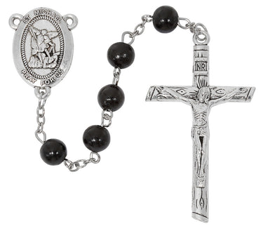 8mm black wood St. Michael rosary with silver oxidized crucifix and center medal displayed on a card