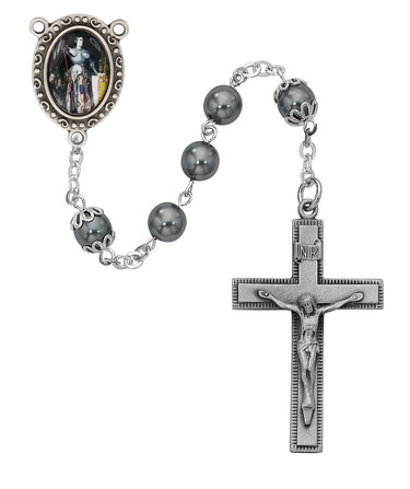 7mm hematite St. Joan of Arc rosary with pewter crucifix and center medal displayed on a flat surface