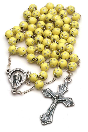 Yellow children's Catholic rosary for girls with 5mm yellow beads decorated with silver stars, chain-link construction, in gift box