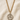 St Dymphna 14KT Gold Filled round medal necklace on a beige fabric background