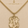 A 14KT gold filled Saint Michael Coast Guard pendant necklace on a gold chain, displayed against a beige background with 'U.S.