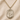 A gold-filled Saint Michael medal pendant necklace on a textured chain, displayed on a beige fabric background with the text '14 KT GOLD FILLED' at the bottom.