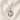 Sterling Silver St Dymphna round medal necklace for women with a pendant on a beige fabric background