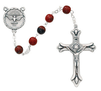 Close-up of 7mm red and black Holy Spirit rosary showing silver oxidized centerpiece with dove detail