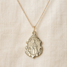 Gold Filled St Dymphna medal necklace with a religious pendant on a beige fabric background