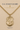 A 14KT gold filled Saint Michael Coast Guard pendant necklace on a gold chain, displayed against a beige background with 'U.S.