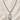 Sterling Silver St Dymphna necklace with a oval pendant on a beige fabric background and 24" chain