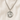Sterling Silver St Dymphna medal necklace with a pendant on a beige fabric background