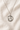 Sterling Silver St Dymphna round medal necklace for women with a pendant on a beige fabric background